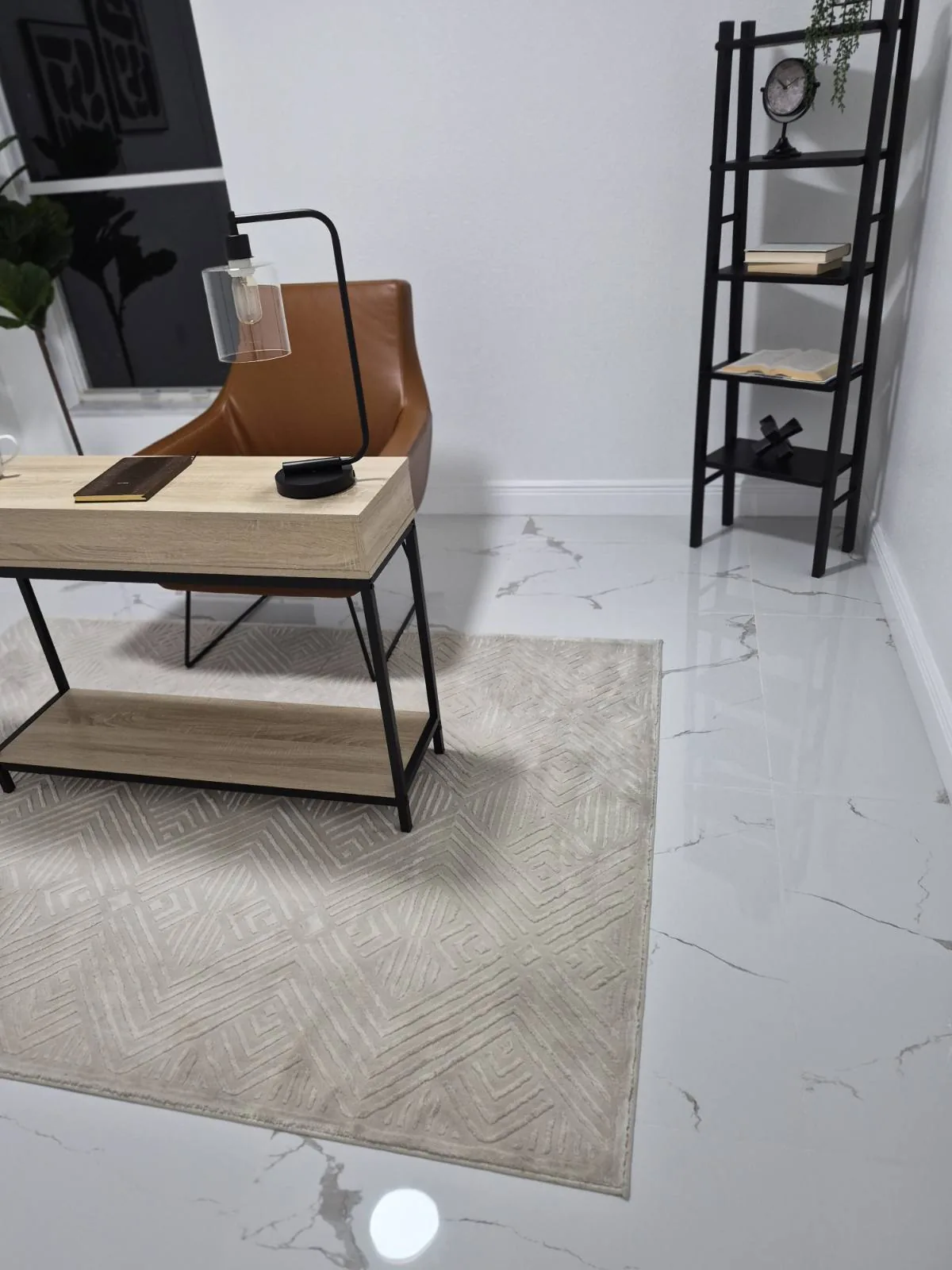 Home office with a desk and rug on freshly cleaned marble tile